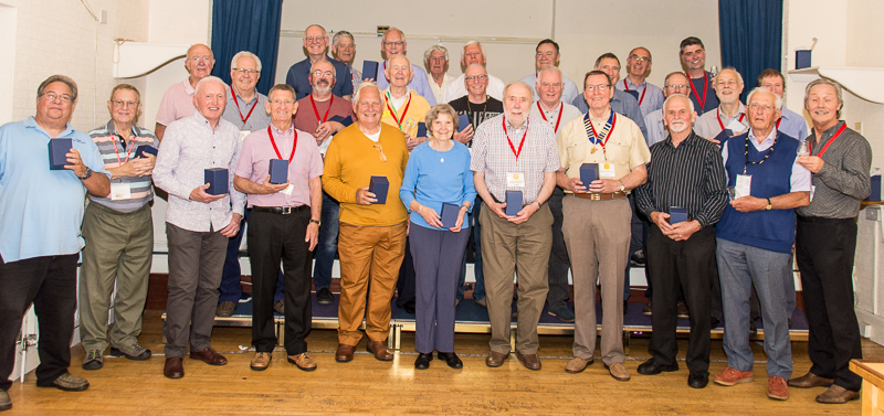 Wayfarers Chorus members with their 30th anniversary memento